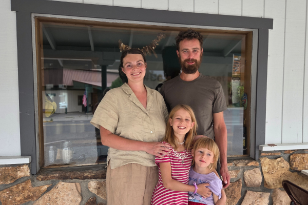 Picture of the Willis Family together in front of a window.